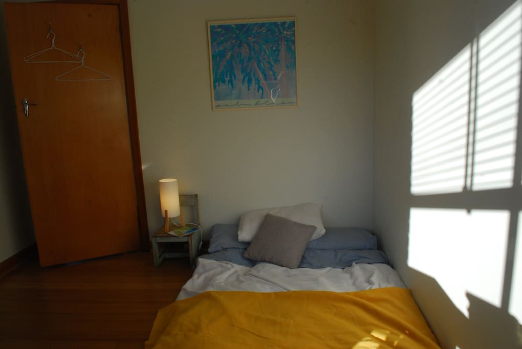 Private, modern sun filled bedroom with 100% Japanese Cotton Futon. Sleeps 2.
