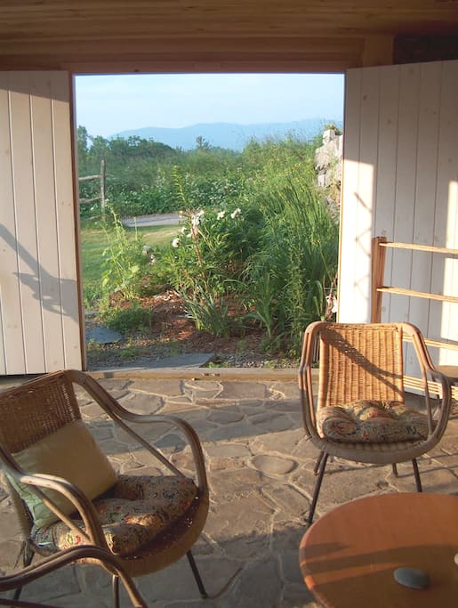 South-facing open porch, mountain view.