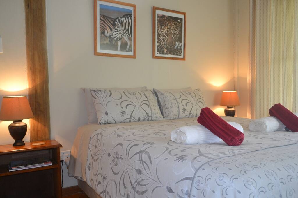 Cosy main bedroom with mountain views.
