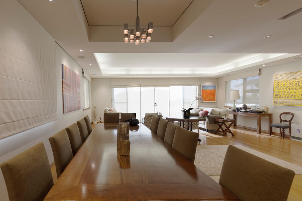 Formal dining with front lounge area. The balcony has views across Sydney and the Harbour Bridge