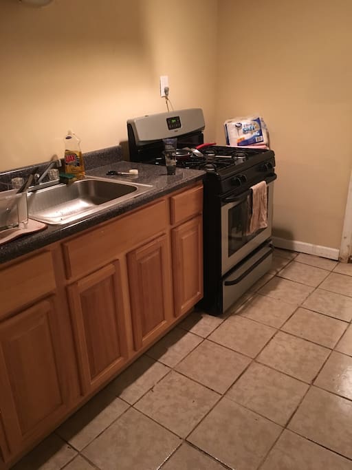 Small but comfortable kitchen that you use to cook. Some kitchenware and utensils provided
