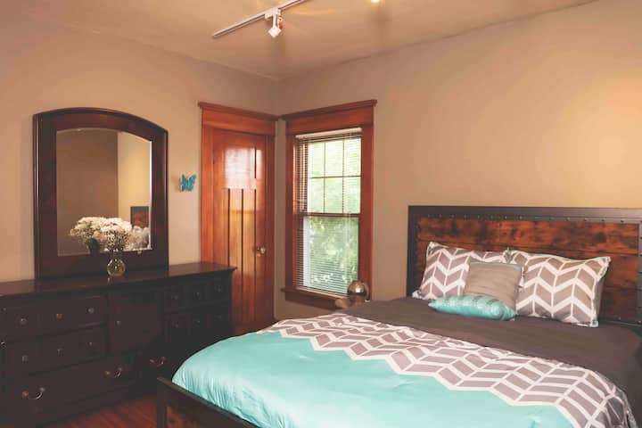 Queen bed. Bedroom #2 second floor. It has a door leading to the back porch.