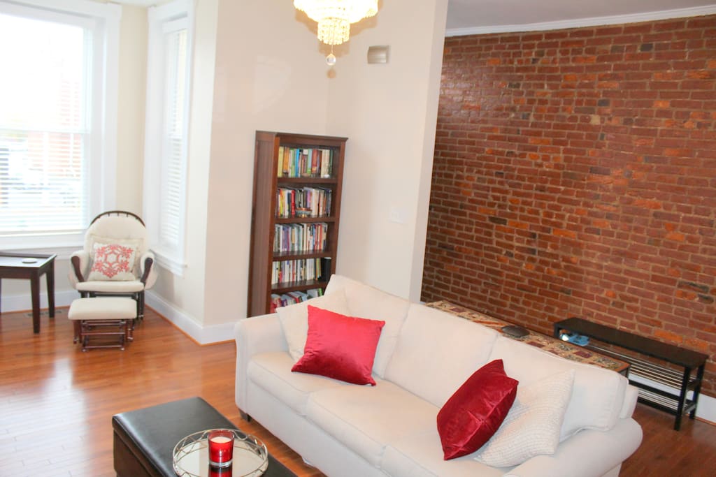 Renovated 1890s charming row home with classic exposed brick wall