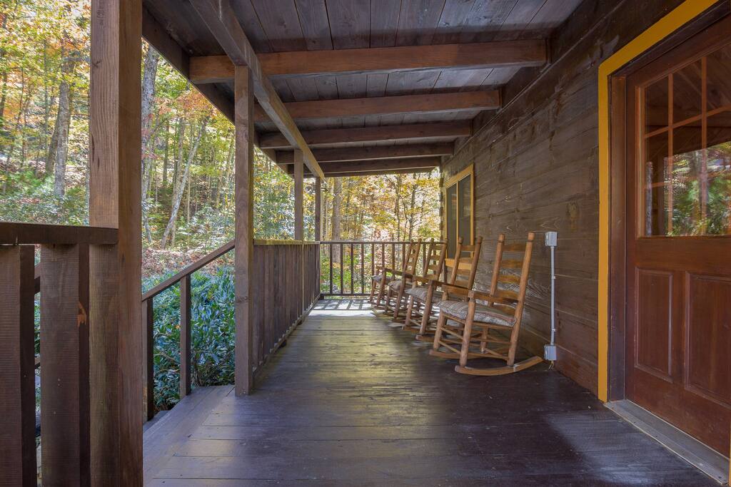 Front Porch With Rocking Chairs And An Old Fashion Wooden Swing.