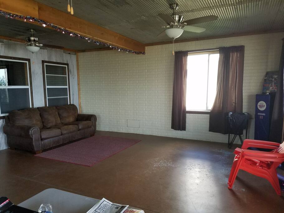The hide-a-bed and main living space on the bottom floor of the cabin.