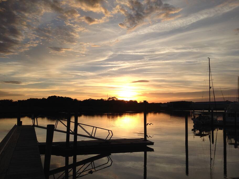 The sun sets on New Year's Eve 2016 over San Sebastian river at boatyard two blocks from house.
