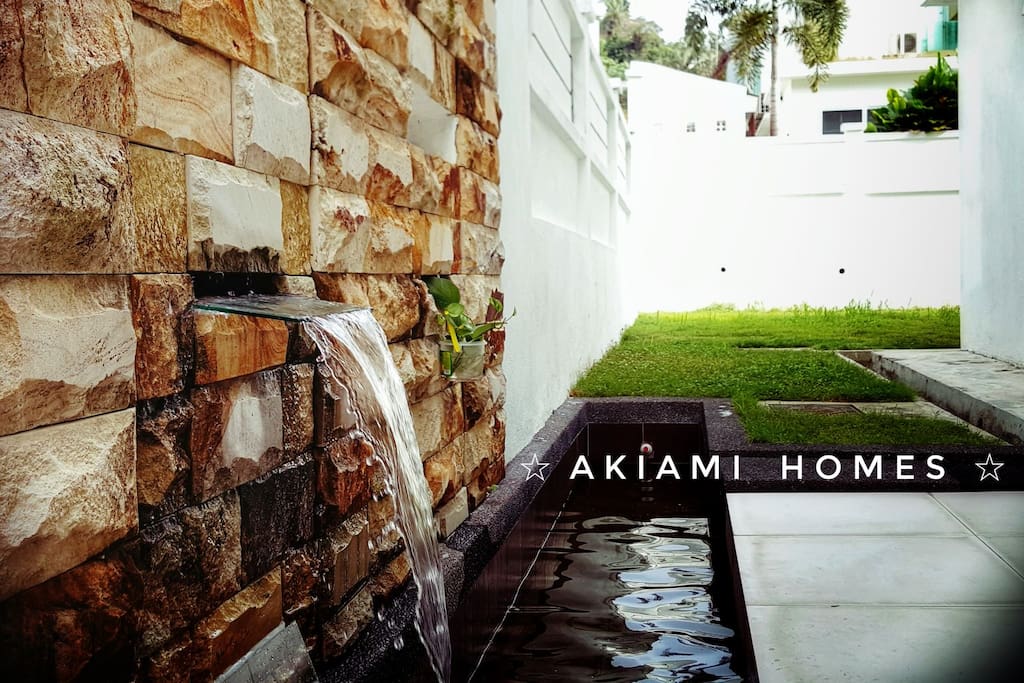 Side yard patio with beautiful water fountain