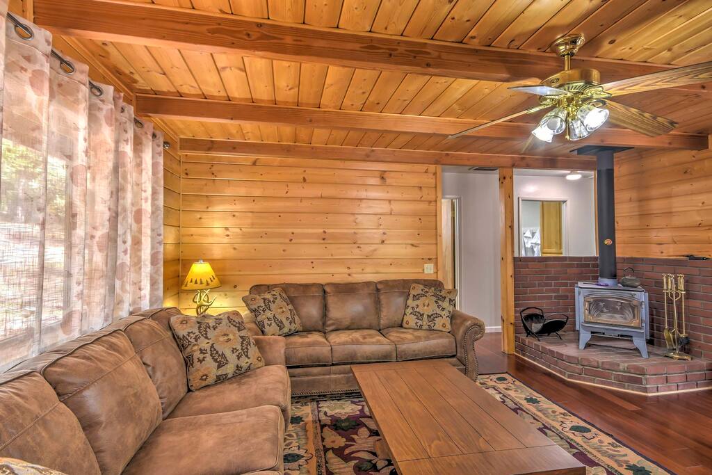 Relax on one of the plush couches while warming up next to the wood-burning stove.
