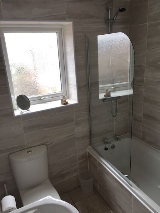 Bathroom with shower over bath