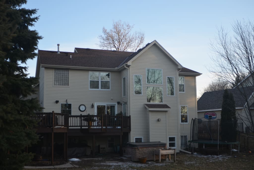 Rear of Home with Hot Tub, Trampoline and Lower Patio