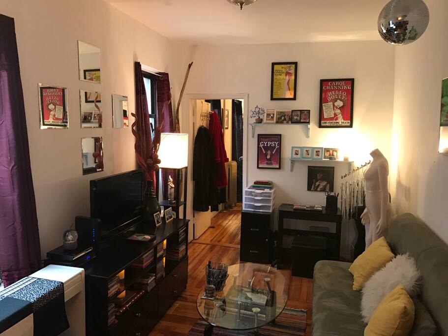 Large living space! With fold out couch, television, desk area.