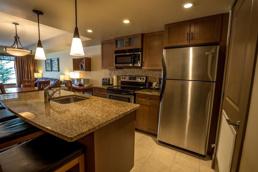 Enjoy the large kitchen with stainless steel appliances and huge breakfast bar