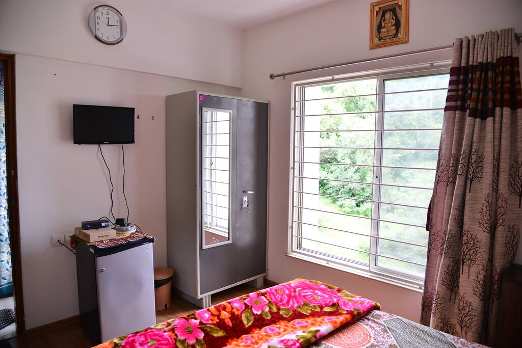 Bedroom with Fridge, TV, Closet (Day View)