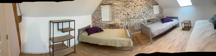 bedroom with three beds including two twin beds