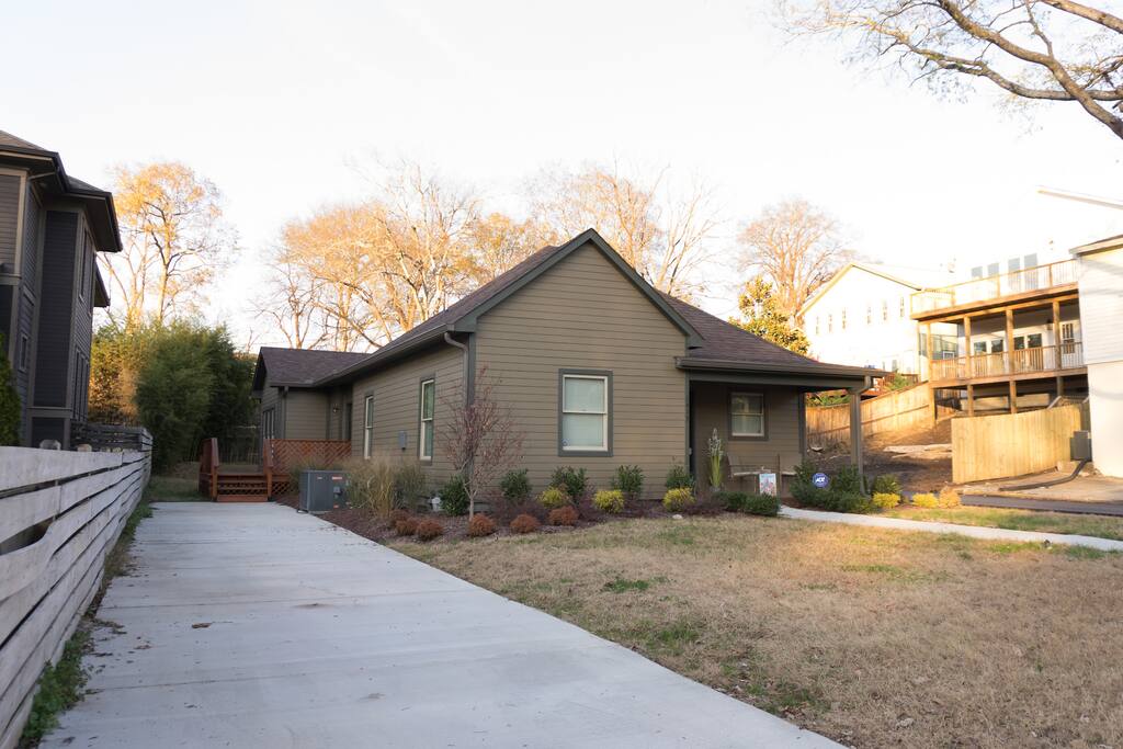Exterior of the home and large driveway. Please do not block cars in driveway. More parking is available on the street.