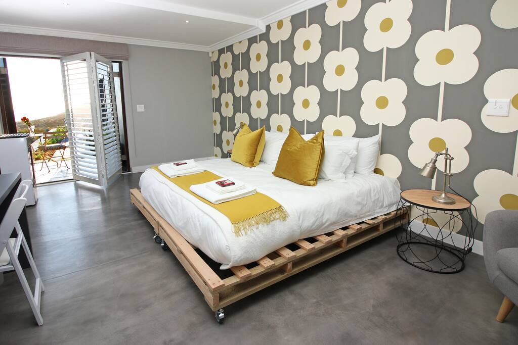 Bedroom leads onto a private patio and garden.