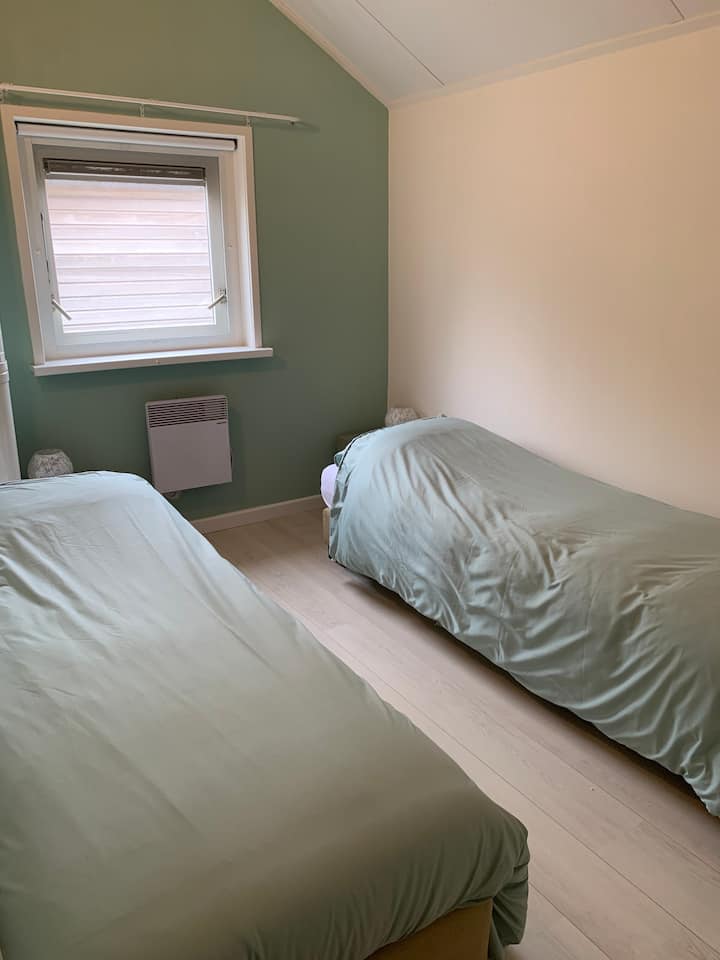 Two single beds. 
Also slide together for a double bed. 