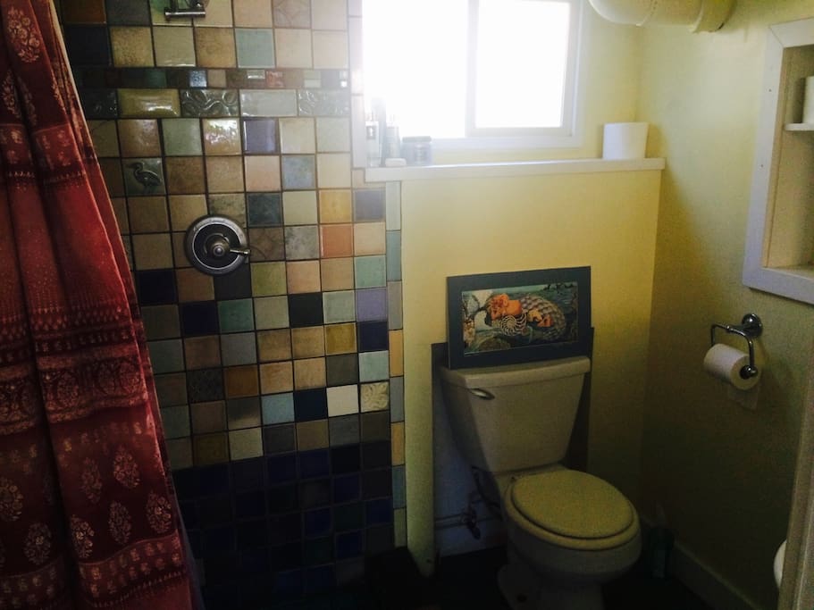 tiled shower in bath