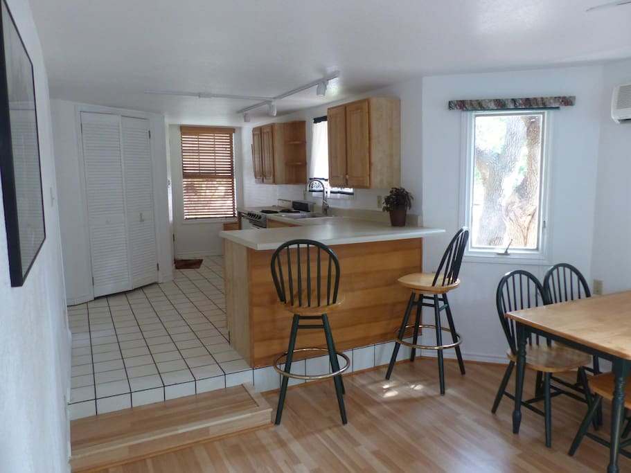 Kitchen bar looking toward kitchen and entry way