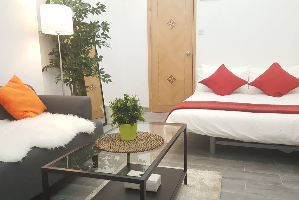 Double sized bed, 2 seats sofa, large coffee table