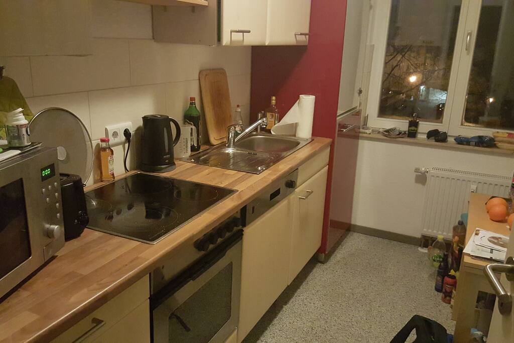 Shared kitchen with microwave and dish washer.