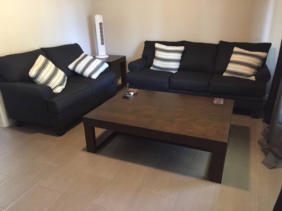 Living room: sofa, love seat and table.