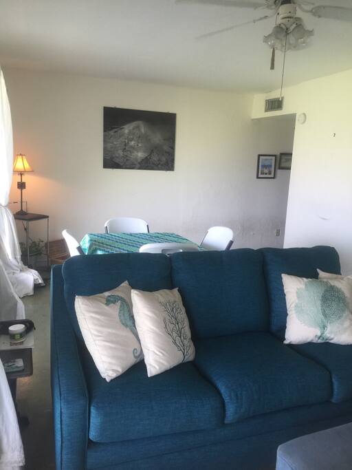 Another view of living dining. The whole area looks out on Gulf of Mexico