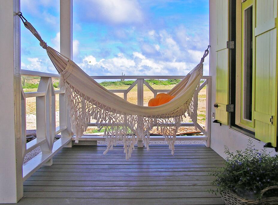 Laze away in your own private hammock with the distant sound of the waves