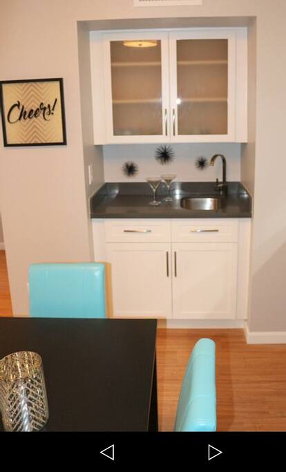 Wet Bar for entertaining along with automatic wine bottle opener