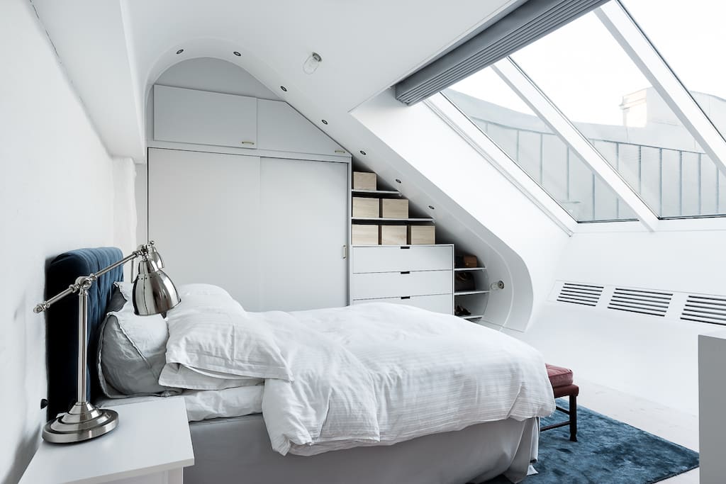 Master bedroom on top floor with skylight windows