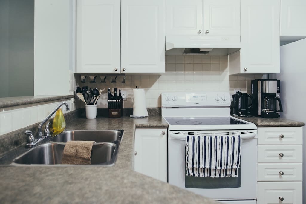 Kitchen, fully stocked with all the cooking essentials. Plus a dishwasher!