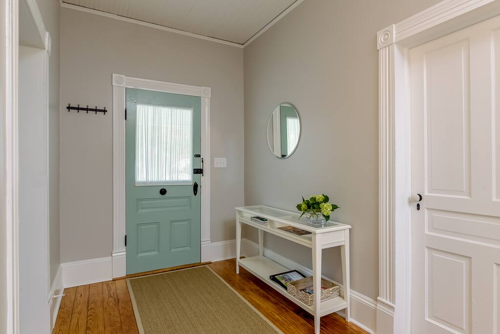 Another view of the front hall. Guests' welcome book to be found on the hall table.