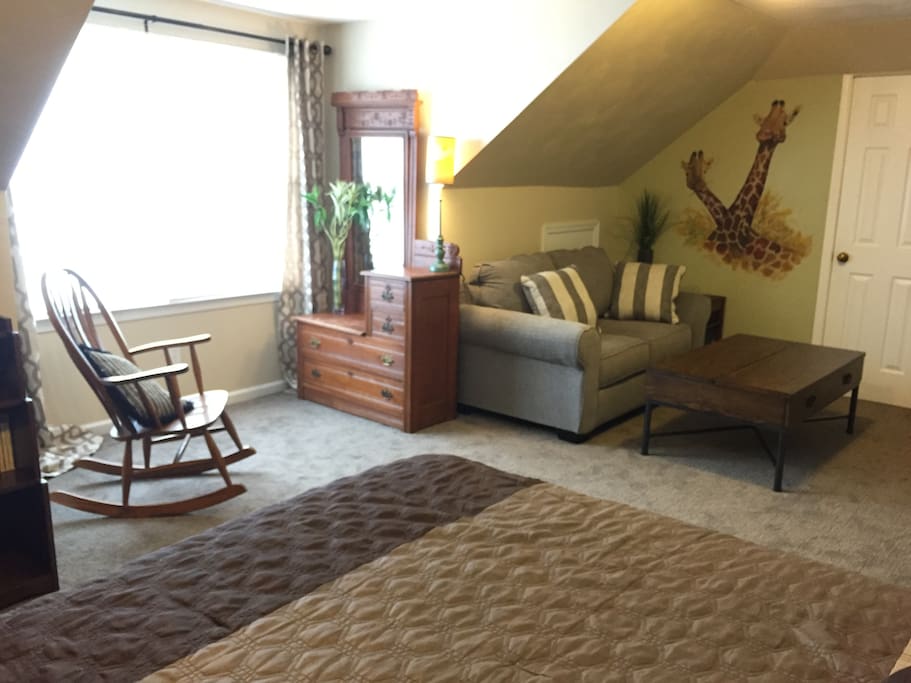 Love seat, coffee table with ability to raise one side for desk work. Closet and dresser space to store clothes may be used.