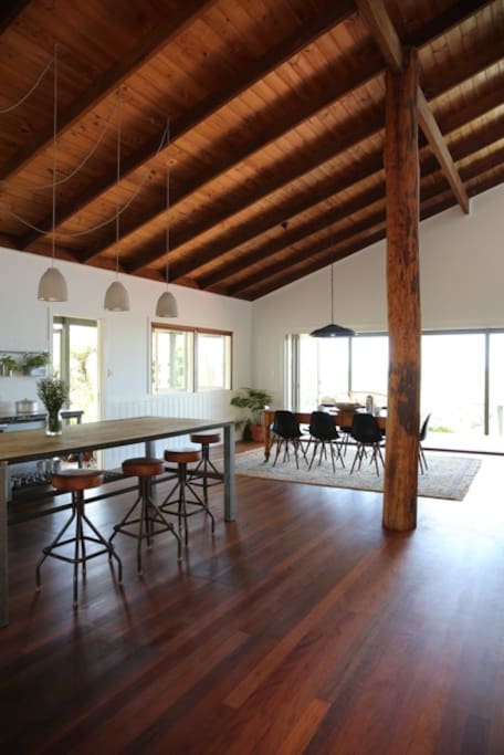 Sit at the recycled timber island bench, or cook in our chef's kitchen, enjoying the ease of cooking with quality appliances including a beautiful Smeg oven. The kitchen is fully provisioned with dishwasher, walk in pantry, double sink and crockery and serving ware for up to 8 people.