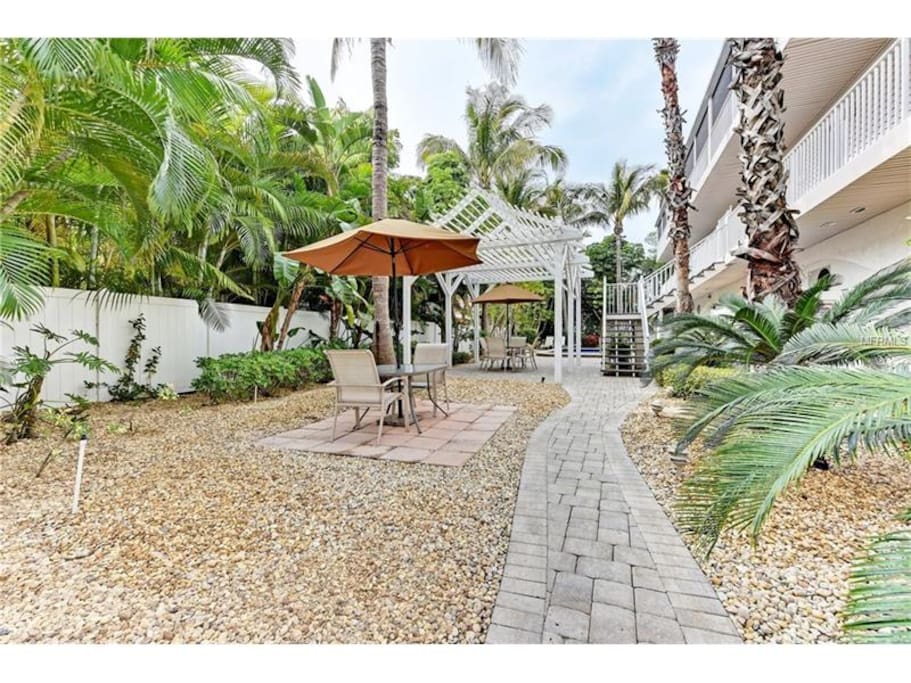 Nice shared outdoor area with tables, pool and outdoor shower