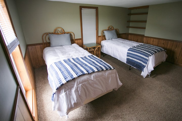 Bedroom upstairs with two twin beds.