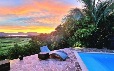 Upon the Bay: villa with pool, garden & bay views