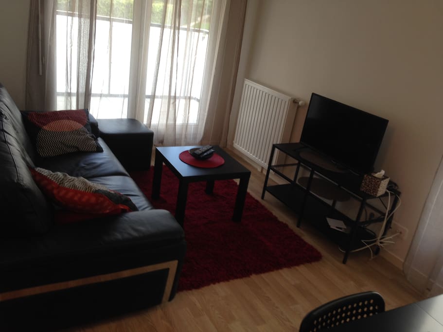 Intimate sitting room with large glass-door access to private balcony