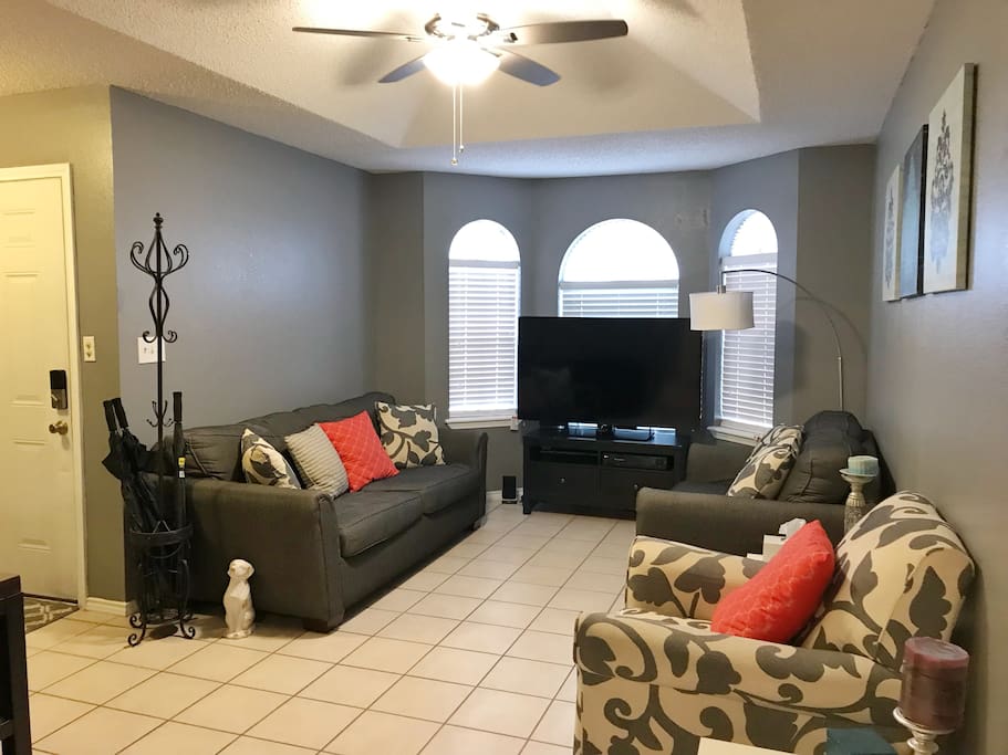 Plush living room seating with warm lighting to cozy up for your favorite show or movie