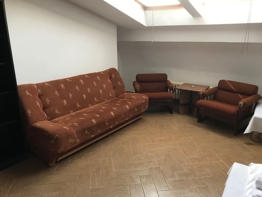 Two single beds, sofa, chairs