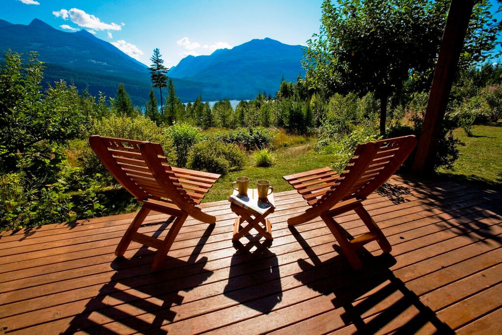 Relax on the deck of your private mountainside cottage nestled within 20 acres of pristine lakefront wilderness