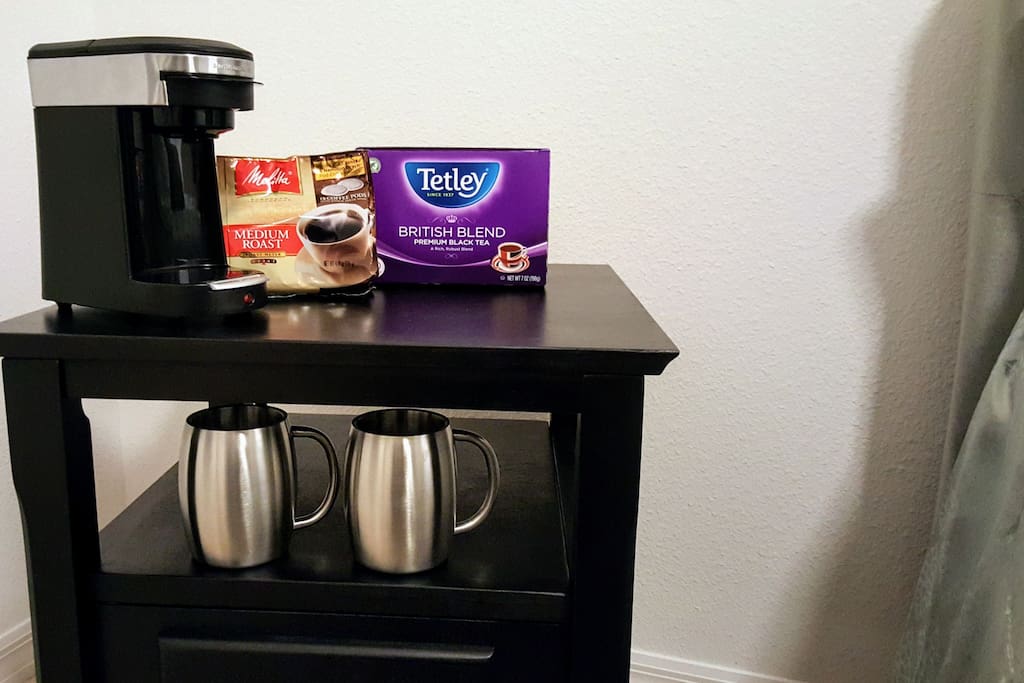 Single serve coffee and tea maker in room.