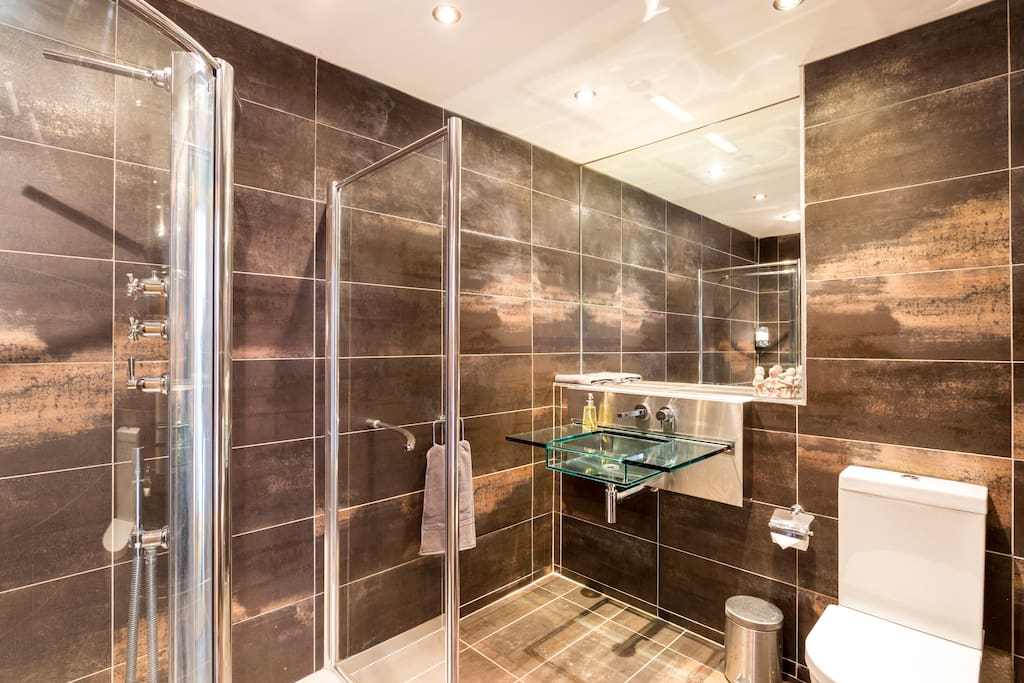 Your own Private Bathroom with walk in shower and glass sink.