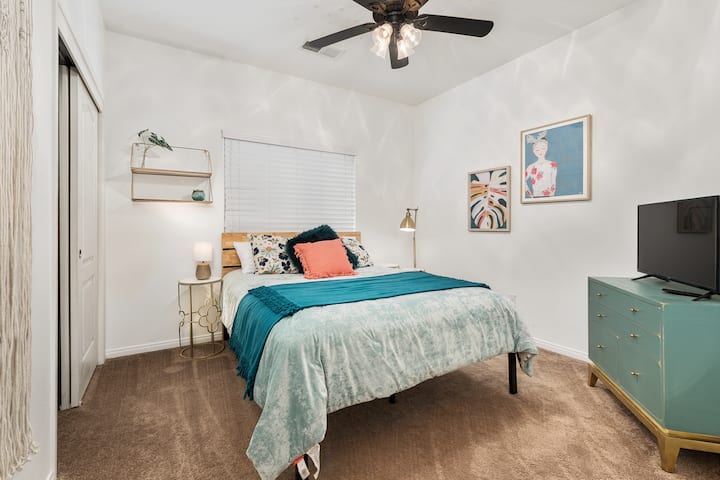 Bedroom #4.  Queen bed and tv.