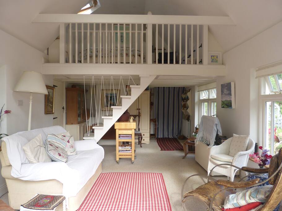 Living area with stairs to mezzanine