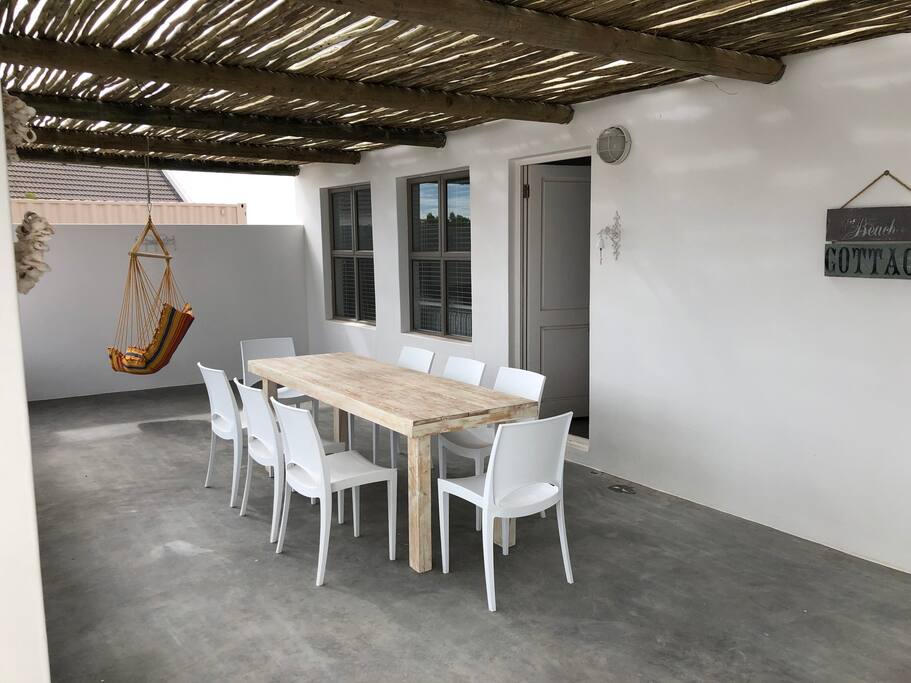 Amazing front patio with 8 seater table.