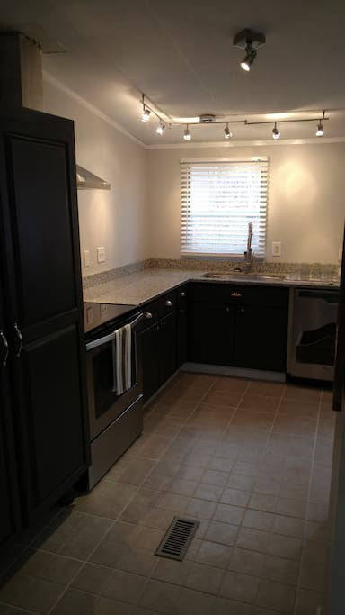 Kitchen pantry, stove, counter and sink