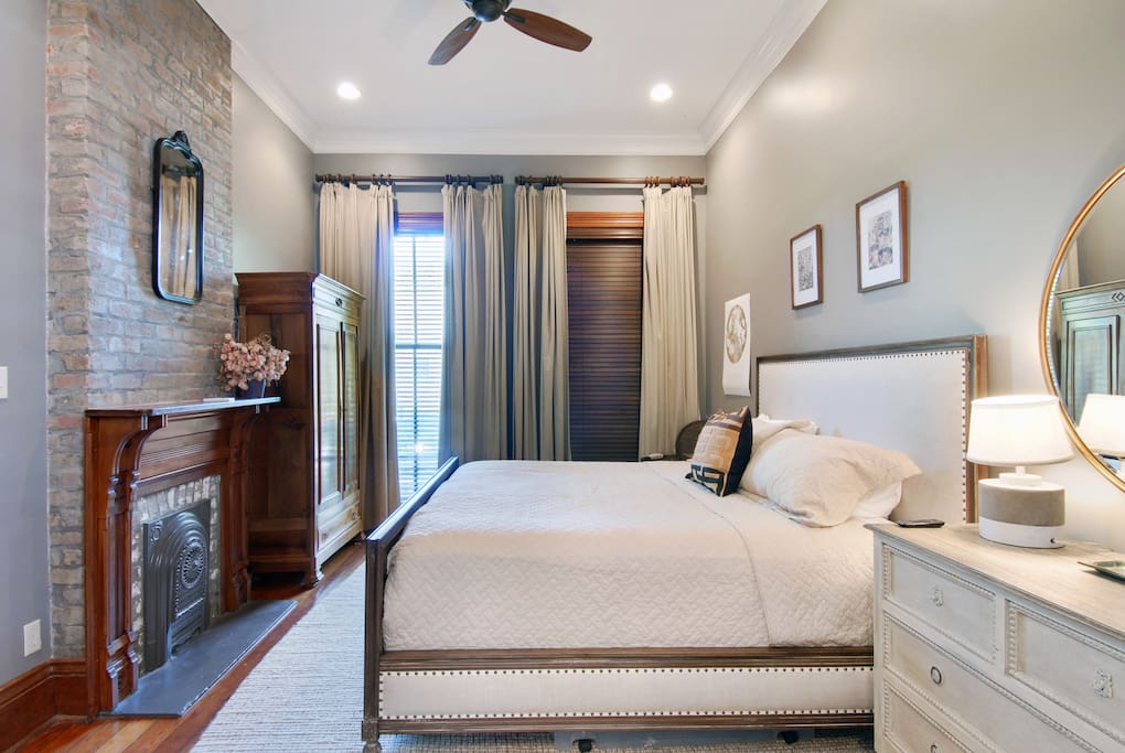 Master bedroom has a king sized bed, bathroom en suite and windows that lead to the front porch.