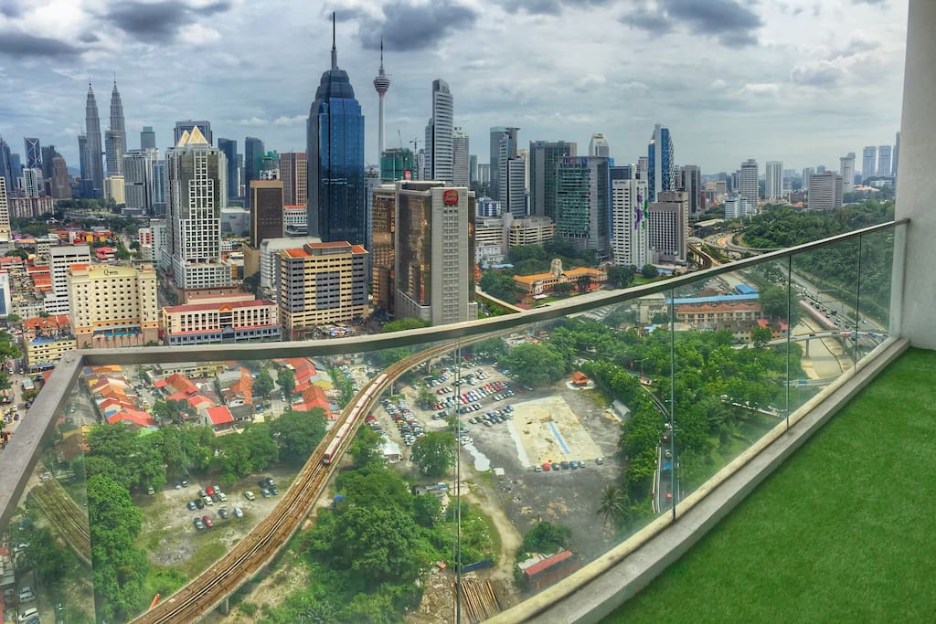 Balcony - actual day view from the apartment's balcony. Skyline of Kuala Lumpur from the comfort of your home.