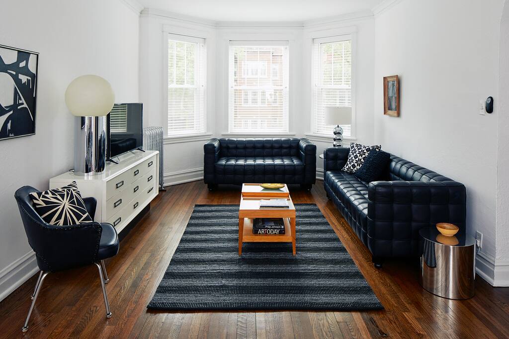 Our chic living room faces the street, and gets plenty of light from the big bay windows